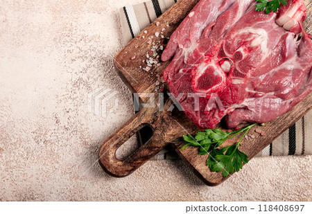 raw steak, veal neck on the bone, fresh meat, on a cutting board, with spices, top view, without people, 118408697