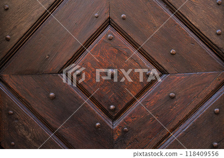 Old wooden background from an antique door Old wooden background from an antique door 118409556