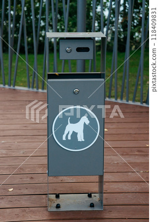 container for dog excrement in the park, close-up. place for walking dog in park. container for dog excrement in the park, close-up. place for walking dog in park. 118409831