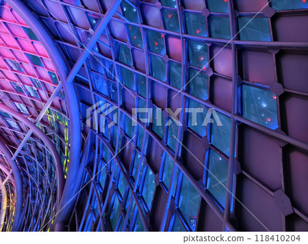 A stunning tunnel with vibrant purple and blue ceiling lights A stunning tunnel with vibrant purple and blue ceiling lights 118410204