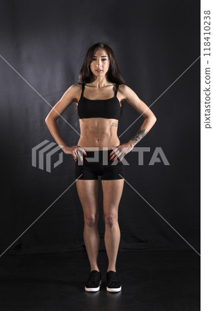 Beautiful athletic girl on a dark background 118410238