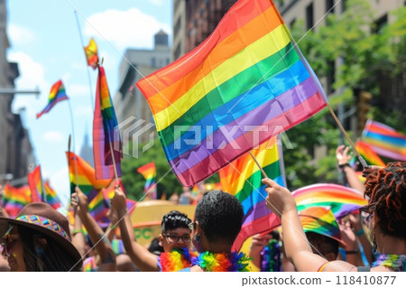 Crowd celebrating with rainbow flags at a public event 118410877