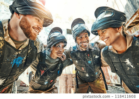 Paintball, happy team and meeting in huddle for game plan, collaboration or strategy on battle field together. Group of paintballers smile in war discussion, teamwork or motivation before match start 118411608