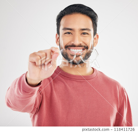 Glasses, happy man and portrait in a studio with a smile from vision showing eye care product. Isolated, white background and happiness of a Asian male model with lens prescription and frame check Glasses, happy man and portrait in a studio with a smile from vision showing eye care product. Isolated, white background and happiness of a Asian male model with lens prescription and frame check 118411726