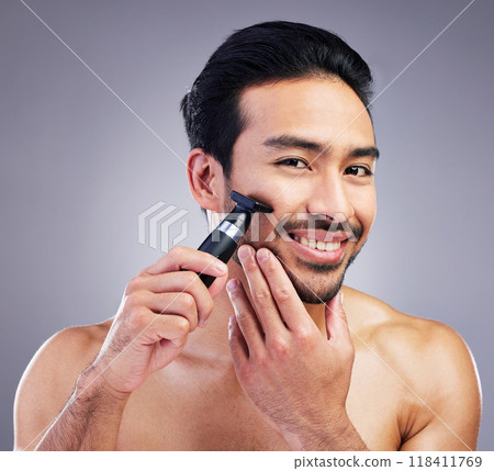 Beard hair trimmer, portrait and man smile for bathroom shaving routine, grooming or morning skincare. Studio razor, facial growth maintenance and Mexican person with clean face on gray background Beard hair trimmer, portrait and man smile for bathroom shaving routine, grooming or morning skincare. Studio razor, facial growth maintenance and Mexican person with clean face on gray background 118411769