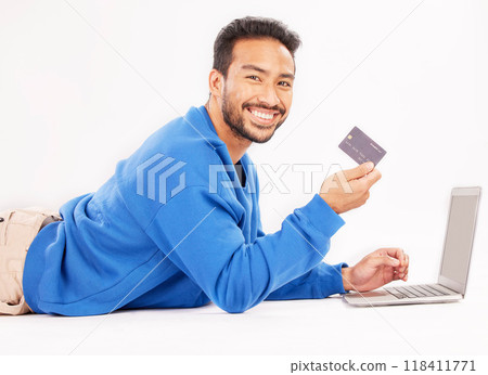 Online shopping, laptop and portrait man smile for credit card discount, fintech service or ecommerce sale. Studio customer, savings transfer payment or relax person banking on white background floor Online shopping, laptop and portrait man smile for credit card discount, fintech service or ecommerce sale. Studio customer, savings transfer payment or relax person banking on white background floor 118411771
