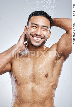 Man in shower with smile, cleaning and studio background for hygiene with shampoo, healthy body. Water, skin and hair care, happy male model washing with happiness on backdrop with bathroom spa time. Man in shower with smile, cleaning and studio background for hygiene with shampoo, healthy body. Water, skin and hair care, happy male model washing with happiness on backdrop with bathroom spa time. 118411791