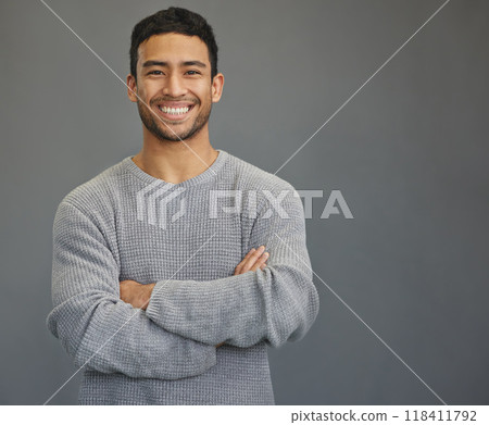 Portrait of man with mockup, arms crossed and smile on studio backdrop in confident casual fashion promo. Relax, confidence and face of male on grey background with happiness, pride and mock up space 118411792