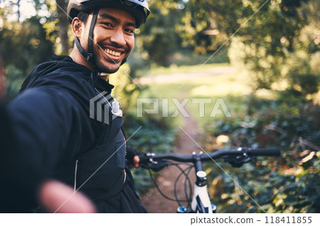 Selfie, cycling and smile with man in nature for social media, training and workout. Happiness, internet and exercise with portrait of cyclist on bike in forest park for adventure, cardio and picture Selfie, cycling and smile with man in nature for social media, training and workout. Happiness, internet and exercise with portrait of cyclist on bike in forest park for adventure, cardio and picture 118411855
