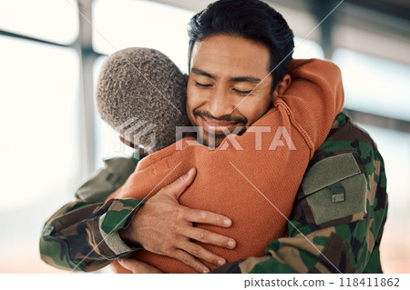 Love, hug and a man soldier with his wife in the airport after returning home from war service as a patriot. Smile, military or army with a happy couple embracing as a welcome to safety and security 118411862
