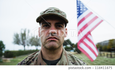 American Soldier At The Cemetery To Commemorate The War Dead During Memorial Day American Soldier At The Cemetery To Commemorate The War Dead During Memorial Day 118411875