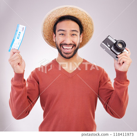 Ticket, camera and portrait of excited man with paperwork for holiday, adventure and fun hat on white background. Smile, travel and happy person with boarding pass for vacation, journey and happiness 118411973