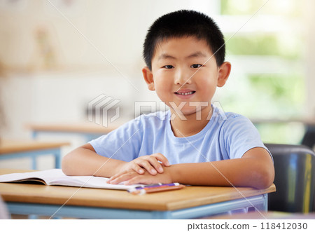 Learning, portrait and Asian boy in classroom for education, exam or studying with book. Preschool, development growth and smile of happy kid and student from Japan in kindergarten for knowledge. Learning, portrait and Asian boy in classroom for education, exam or studying with book. Preschool, development growth and smile of happy kid and student from Japan in kindergarten for knowledge. 118412030
