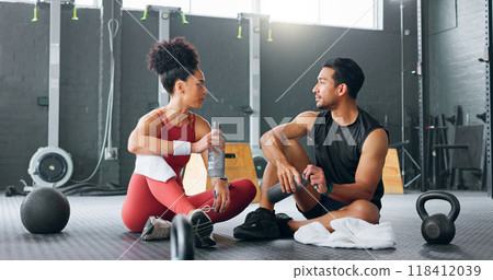 Personal trainer, man and woman at gym, break and conversation for exercise plan, water and sportswear. .Fitness instructor, training routine or athlete for mental motivation, body and healthy cardio Personal trainer, man and woman at gym, break and conversation for exercise plan, water and sportswear. .Fitness instructor, training routine or athlete for mental motivation, body and healthy cardio 118412039