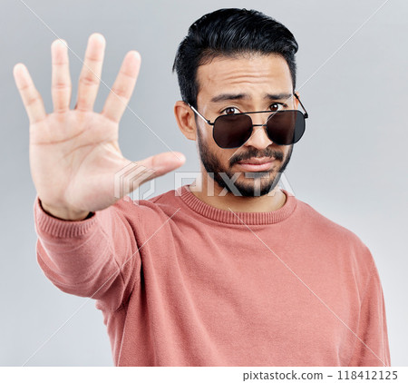 Stop, portrait and a cool man with sunglasses isolated on a white background in a studio. No, rejection and an Asian guy with a hand sign for warning, security and bouncer with decline on a backdrop Stop, portrait and a cool man with sunglasses isolated on a white background in a studio. No, rejection and an Asian guy with a hand sign for warning, security and bouncer with decline on a backdrop 118412125