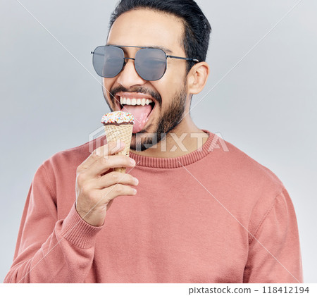 Ice cream, happy and man in studio with dessert, fun and eating snack against grey background. Cone, sweet and mexican male smile, cheerful and carefree on mockup, space or isolated copy space Ice cream, happy and man in studio with dessert, fun and eating snack against grey background. Cone, sweet and mexican male smile, cheerful and carefree on mockup, space or isolated copy space 118412194