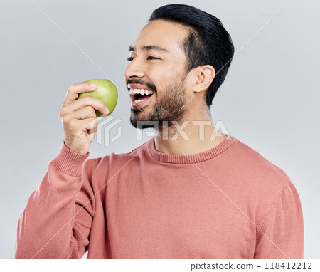 Healthy, happy and an Asian man eating an apple isolated on a white background in a studio. Smile, food and a Chinese guy taking a bite from a fruit for nutrition, diet or hungry on a backdrop Healthy, happy and an Asian man eating an apple isolated on a white background in a studio. Smile, food and a Chinese guy taking a bite from a fruit for nutrition, diet or hungry on a backdrop 118412212