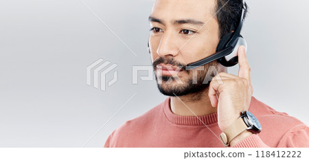Headset, support and a man for a call center with mockup isolated on white background. Contact us, thinking and Asian customer service employee consulting for telemarketing on a backdrop with space 118412222