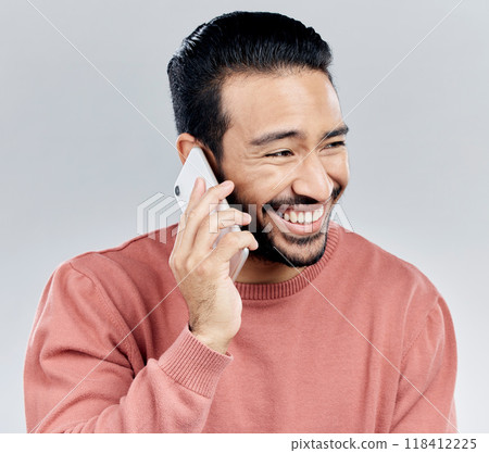 Asian man, phone call and laughing for funny conversation, discussion or joke against a white studio background. Happy male laugh and talking on mobile smartphone for fun chat, communication or meme 118412225