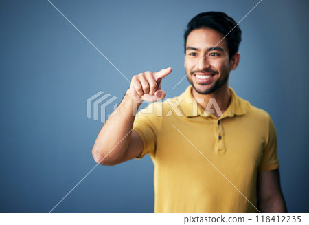 Happy, finger and man in studio with hand for mockup space or ai on a blue background. Smile of an asian male model person pointing for product placement and creative brand isolated for gradient logo 118412235