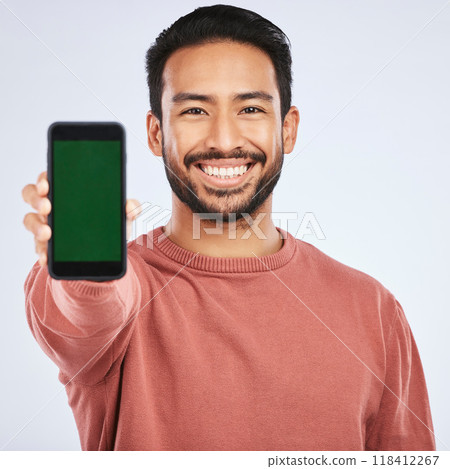Phone, green screen and portrait of asian man with mockup for app, menu or checklist on grey background. Space, display and face of male person with smartphone platform for social media or networking Phone, green screen and portrait of asian man with mockup for app, menu or checklist on grey background. Space, display and face of male person with smartphone platform for social media or networking 118412267