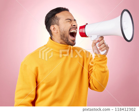 Asian man, megaphone and screaming for discount, sale or alert against a pink studio background. Male person shouting for advertising, marketing or announcement in notification, voice or protest 118412302