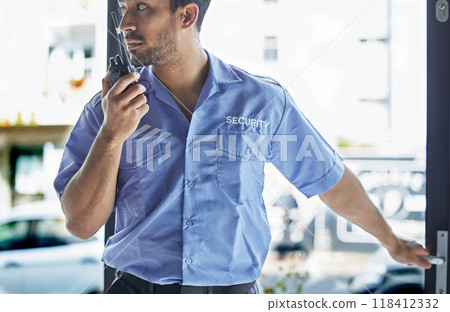Man, radio and watch at job as security guard in city, walkie-talkie and contact for backup, support or safety in building. Protection agent, tech and report information at door in crime surveillance Man, radio and watch at job as security guard in city, walkie-talkie and contact for backup, support or safety in building. Protection agent, tech and report information at door in crime surveillance 118412332