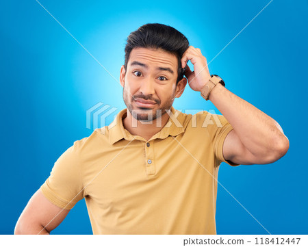 Portrait, head scratch and man confused over question, doubt or uncertain about problem crisis, error or decision. Studio, face and Asian male person unsure about choice isolated on blue background 118412447