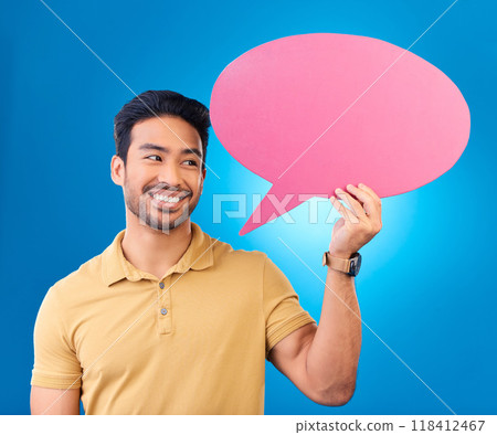 Happy, speech bubble and thinking Asian man for communication, feedback or chat. Excited, idea and a person with a board for conversation isolated on a blue background in a studio with space 118412467