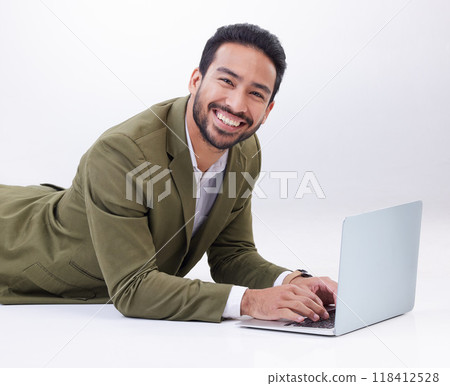 Happy, laptop and portrait of a man in studio relaxing while typing on a keyboard doing research. Happiness, smile and Indian male model with computer working on project isolated by white background. Happy, laptop and portrait of a man in studio relaxing while typing on a keyboard doing research. Happiness, smile and Indian male model with computer working on project isolated by white background. 118412528