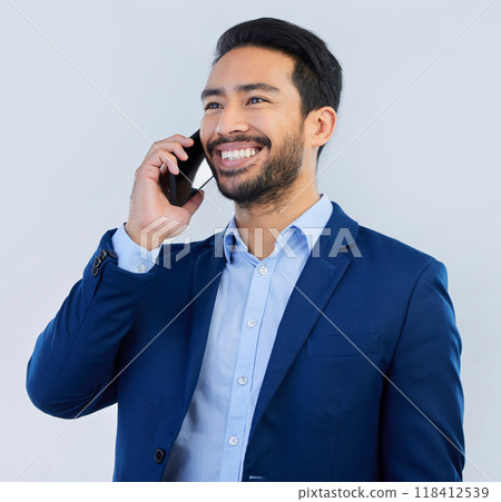 Smile, smartphone and Indian man in studio, talking and networking on white background. Phone call, conversation and businessman in suit, communication and technology for investor trading at startup. 118412539
