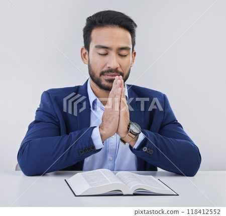 Mockup, faith and Asian man, praying, bible and guidance against grey studio background. Japanese male, believer and Christian guy with holy book, prayer and hope for solution, religious or gratitude Mockup, faith and Asian man, praying, bible and guidance against grey studio background. Japanese male, believer and Christian guy with holy book, prayer and hope for solution, religious or gratitude 118412552