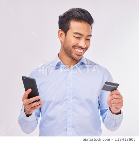 Man with smartphone, credit card and smile for ecommerce, fintech and online shopping isolated on white background. Payment, internet banking and technology with bank app and happy male in studio Man with smartphone, credit card and smile for ecommerce, fintech and online shopping isolated on white background. Payment, internet banking and technology with bank app and happy male in studio 118412605