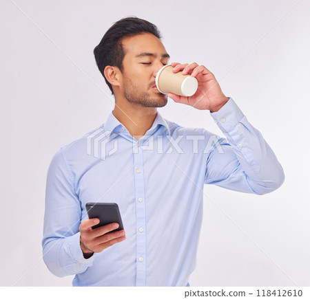 Phone, drinking coffee and business man in studio isolated on a white background. Cellphone, tea break and male professional with smartphone for social media, web browsing or typing on mobile app. 118412610