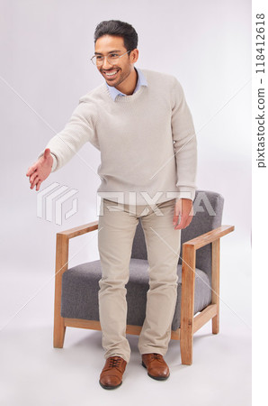 Handshake offer of business man isolated on a white background for welcome meeting or psychologist client hello. Asian person or therapist shake hands for deal or introduction with armchair in studio 118412618