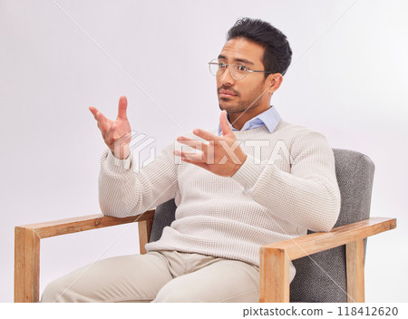 Psychologist, doctor and mental health, man in therapy and listening with treatment on studio background. Therapist, counseling and serious male with medical consultation, help and psychology 118412620