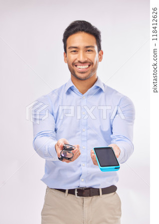 Portrait, ecommerce and glasses with a man in studio on a gray background to offer pos payment for eye care. Happy, smile with an agent marketing while holding a wireless finance device and eyewear Portrait, ecommerce and glasses with a man in studio on a gray background to offer pos payment for eye care. Happy, smile with an agent marketing while holding a wireless finance device and eyewear 118412626
