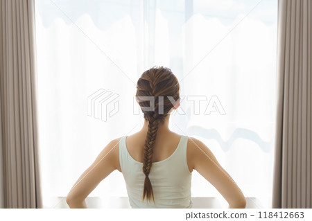 A young woman showing poses in an online yoga salon broadcast 118412663
