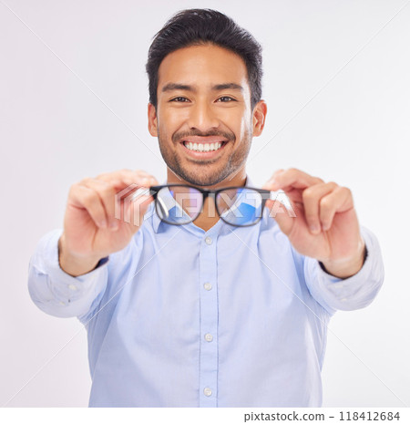 Glasses, vision portrait and man happy in studio for eye care, lens or frame isolated on a white background. Smile of asian male model show optometry eyewear brand in hands to check eyesight or focus Glasses, vision portrait and man happy in studio for eye care, lens or frame isolated on a white background. Smile of asian male model show optometry eyewear brand in hands to check eyesight or focus 118412684