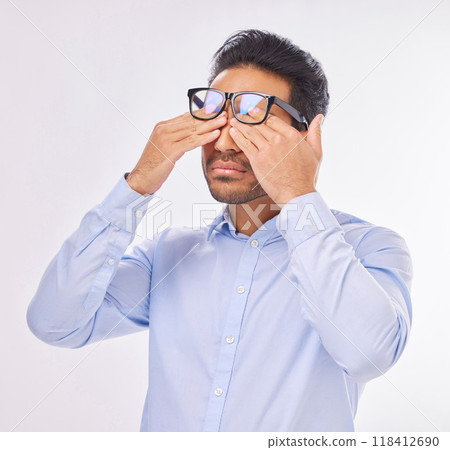 Man in studio with glasses, rubbing eyes for vision, eyesight and tired on isolated on white background with burnout. Fatigue, stress and exhausted Indian businessman with prescription lens in frames Man in studio with glasses, rubbing eyes for vision, eyesight and tired on isolated on white background with burnout. Fatigue, stress and exhausted Indian businessman with prescription lens in frames 118412690