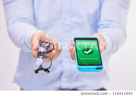 Man, hands and phone with transaction approval or glasses for ecommerce or purchase against a white studio background. Hand of male holding spectacles and mobile smartphone for electronic payment Man, hands and phone with transaction approval or glasses for ecommerce or purchase against a white studio background. Hand of male holding spectacles and mobile smartphone for electronic payment 118412693
