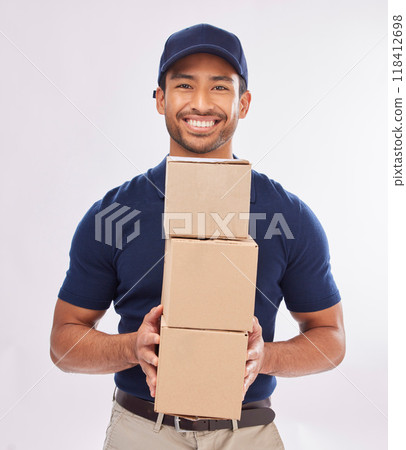 Delivery man portrait, shipping export and box of a employee in studio with courier service and a smile. Boxes, supply chain and happiness of a worker with online shopping, mail services and parcel Delivery man portrait, shipping export and box of a employee in studio with courier service and a smile. Boxes, supply chain and happiness of a worker with online shopping, mail services and parcel 118412698