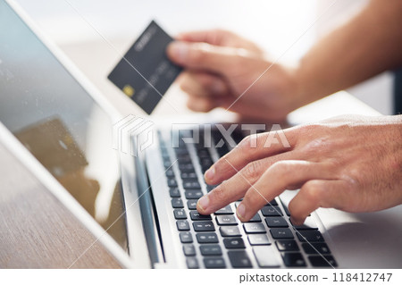 Hands, laptop and credit card for ecommerce, online shopping or electronic purchase on wooden desk. Hand of shopper working on computer keyboard for internet banking, app or wireless transaction Hands, laptop and credit card for ecommerce, online shopping or electronic purchase on wooden desk. Hand of shopper working on computer keyboard for internet banking, app or wireless transaction 118412747