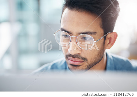 Focus, computer and business man in office for idea research, contemplating and planning. Website, technology and digital with male employee reading online for proposal, project and email news 118412766