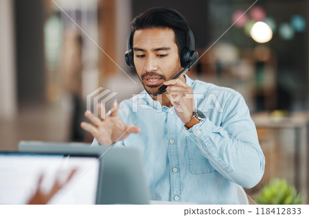 Asian man, call center and consulting with headphones on laptop in customer service or desktop support at office. Male consultant agent talking with headset on PC for telemarketing or online advice 118412833
