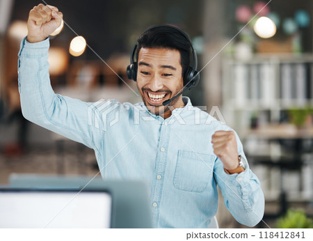 Asian man, call center and celebration for winning, sale or discount on laptop in telemarketing at office. Happy and excited male consultant agent in joy for win, victory or achievement on computer 118412841