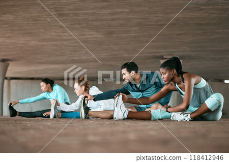Group, exercise and people stretching as a fitness club for sports, health and wellness in an urban town together. Sport, commitment and friends training or team doing pilates workout in yoga 118412946