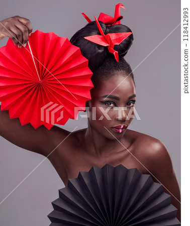 Creative beauty, portrait and makeup with black woman in studio for art and culture. Fashion, cosmetics and paper design with female model on grey background for asian, origami or color Creative beauty, portrait and makeup with black woman in studio for art and culture. Fashion, cosmetics and paper design with female model on grey background for asian, origami or color 118412993