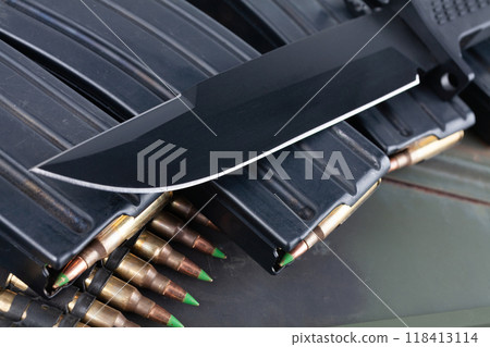 Bayonet and ammunition belt with cartridges on ammo boxes Bayonet and ammunition belt with cartridges on ammo boxes 118413114