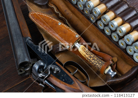 hunting double barreled side shotgun with cartridges in bandolier. 118413127